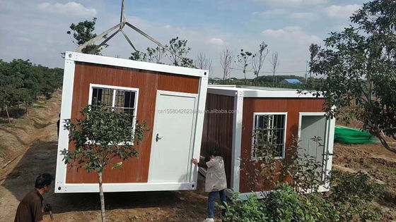 Προσαρμοσμένο χρώμα 20ft προκατασκευασμένο επίπεδο πακέτο χύδην κοντέινερ Φρέμα σπίτι για τους μετανάστες εργάτες στο εργοτάξιο